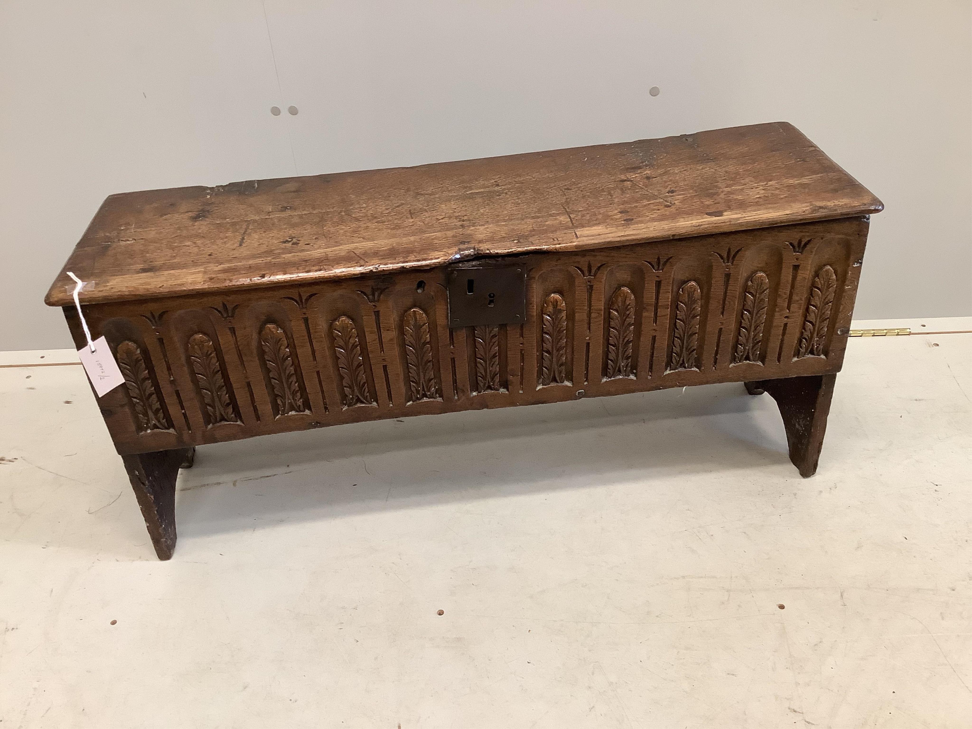 A late 17th century style carved oak six plank coffer, width 96cm, depth 29cm, height 45cm. Condition - fair